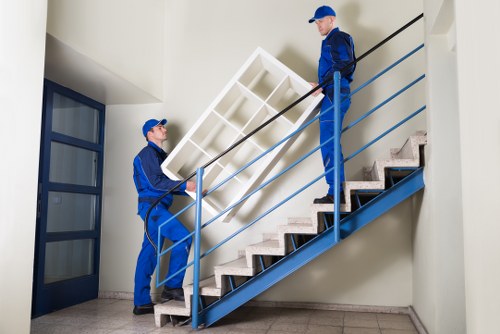 Office furniture and equipment being prepared for transport