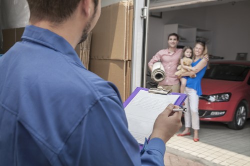 Furniture and boxes being unloaded at a new home