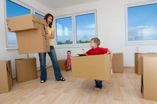 Professional movers loading furniture into a removal van
