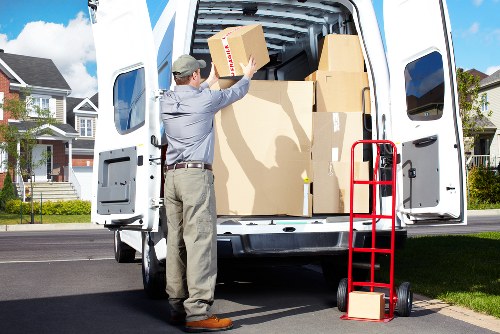 Packed office equipment prepared for commercial moves in Claphamcommon