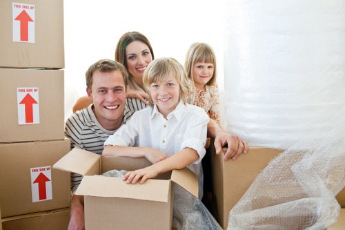 Packed household boxes ready for a moving truck in Claphamcommon