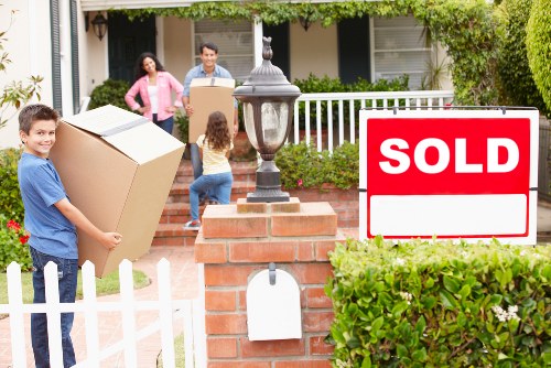 Professional movers transporting business furniture during a Claphamcommon relocation